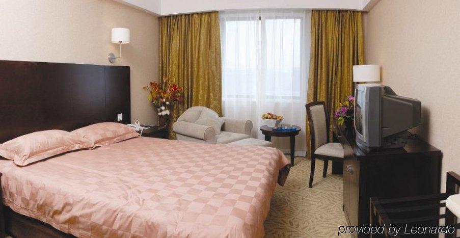 Ariva Beijing West Hotel Pequim Quarto foto